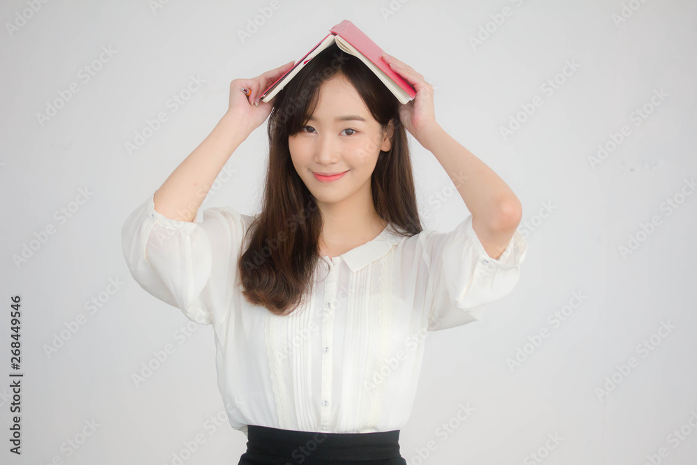 portrait of thai china adult office girl white shirt reading red book portrait of thai china adult office girl white shirt reading red book