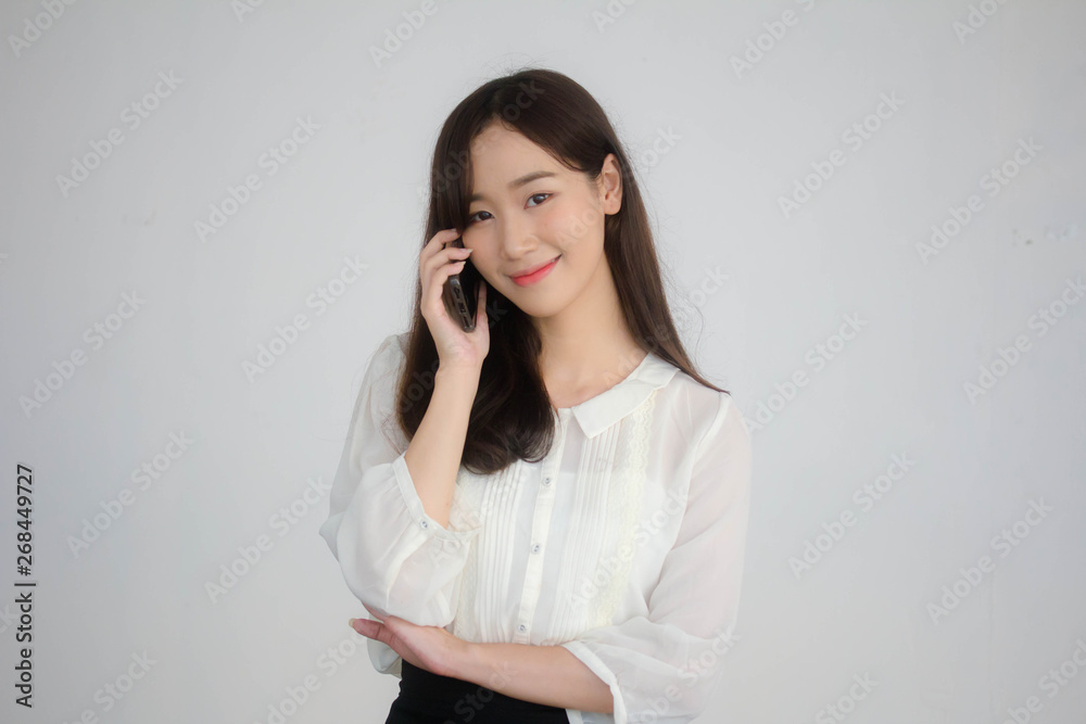 portrait of thai china adult office girl white shirt walk and calling smart phone portrait of thai china adult office girl white shirt walk and calling smart phone