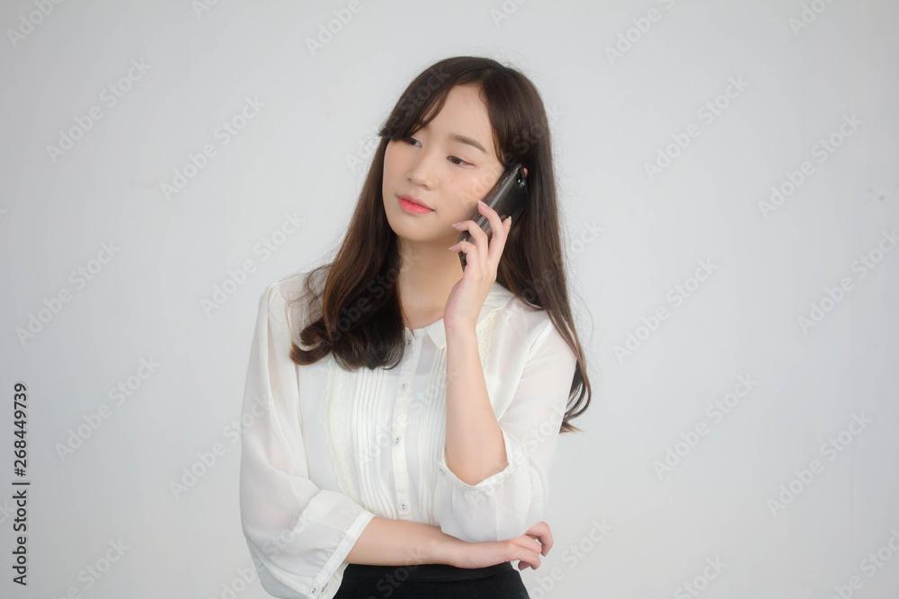 portrait of thai china adult office girl white shirt walk and calling smart phone portrait of thai china adult office girl white shirt walk and calling smart phone