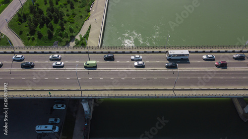 Drone's Eye View - Aerial view of urban traffic jam on city bridge