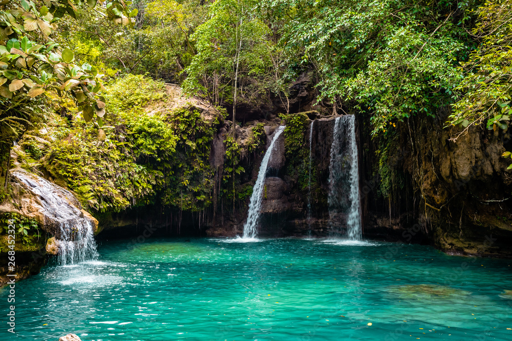 Kawasan Falls on Cebu island in Philippines, turquoise waterfalls