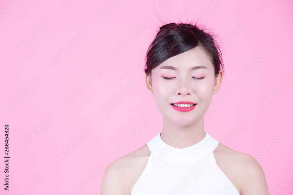 Fashion girl dress up with hand gestures on a pink background. Fashion girl dress up with hand gestures on a pink background.