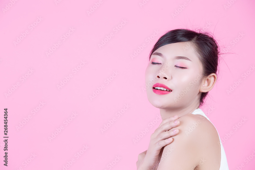 Fashion girl dress up with hand gestures on a pink background. Fashion girl dress up with hand gestures on a pink background.