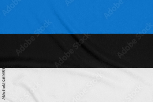 Flag of Estonia on textured fabric. Patriotic symbol