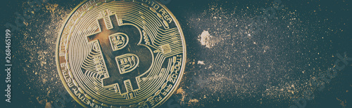 Gold bitcoin on black background