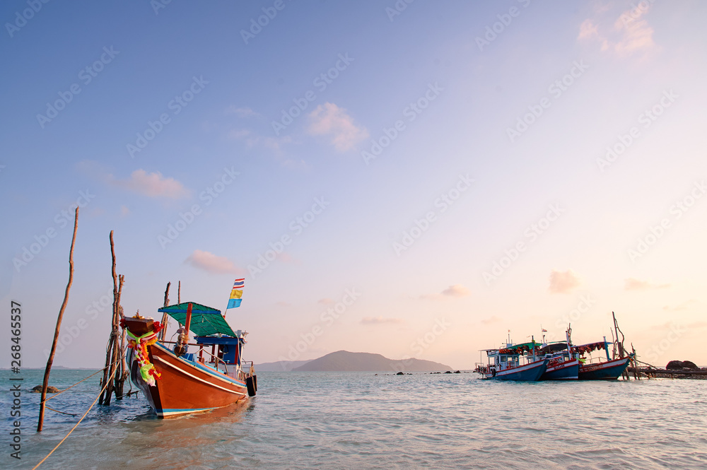 Fototapeta premium Traveling by Thailand. Ocean, beach and old fishing boat.