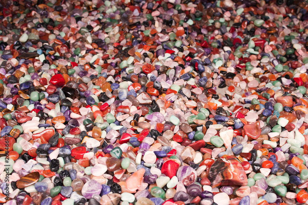 Natural background - pile of semi precious jewelery stones closeup. best for craftmanship, interior design