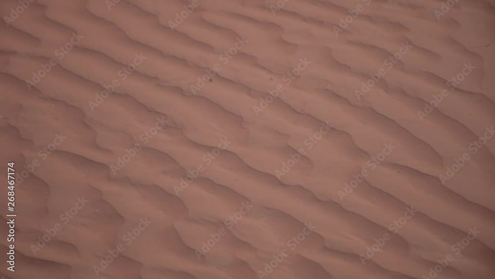 Panorama design of the rippling textured sand dunes background in the beautiful sunshine in the United Arab Emirates.