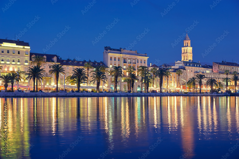 Travel by Croatia. Beautiful landscape with Split Old Town on sea shore at night.
