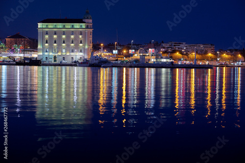 Travel by Croatia. Beautiful landscape with Split Old Town on sea shore at night. © luengo_ua
