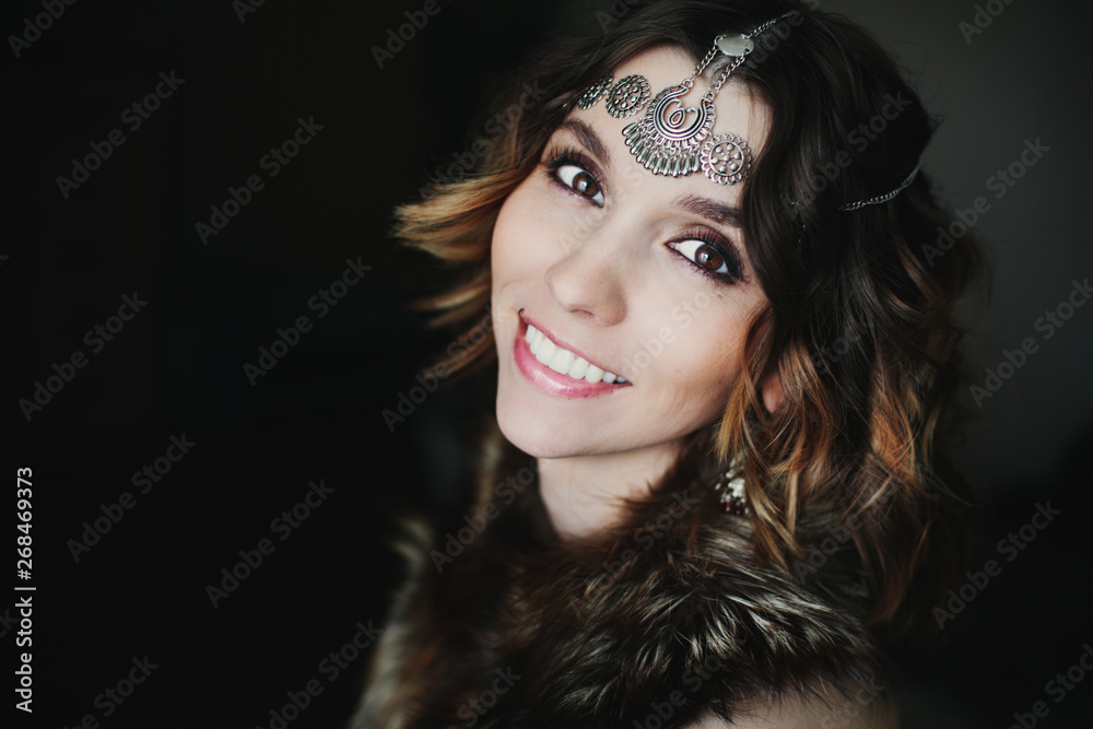 Fototapeta premium Close up portrait tribal style of beautiful woman wearing jewellery and fur