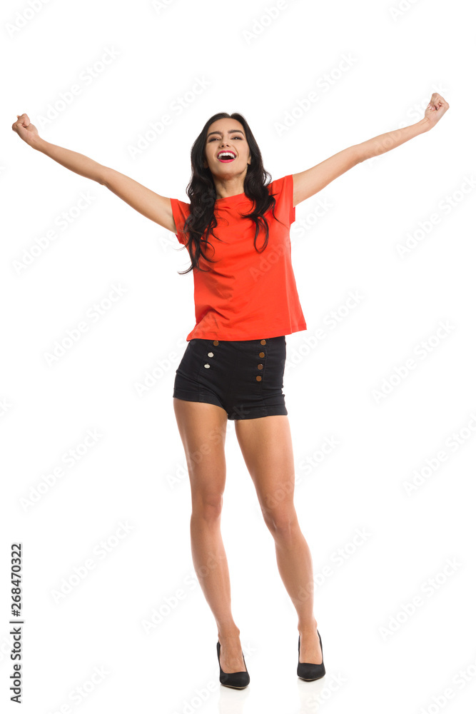Excited Young Woman Is Holding Arm Outstretched And Shouting Excited Young Woman Is Holding Arm Outstretched And Shouting