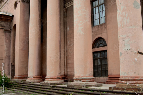 The old looking soviet union's architectural building with large pillars and bas-reliefs. photo