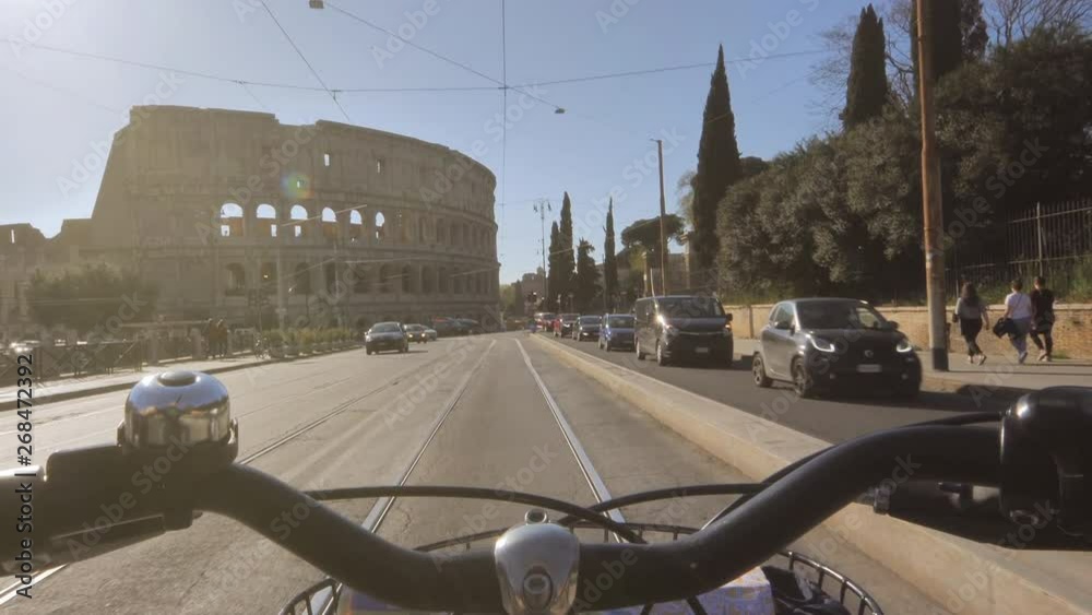 Rome,01/05/2019:riding bicycle to colosseum handle point of view