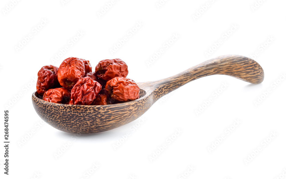 Chinese jujube isolated In wooden spoon on white background Chinese jujube isolated In wooden spoon on white background
