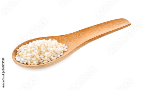 rice seeds In wooden spoon on white background