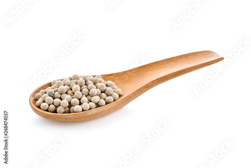 pepper seeds In wooden spoon on white background