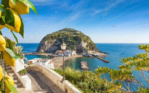 Sant'Angelo village, giant green rock in blue sea near Ischia Island, Italy