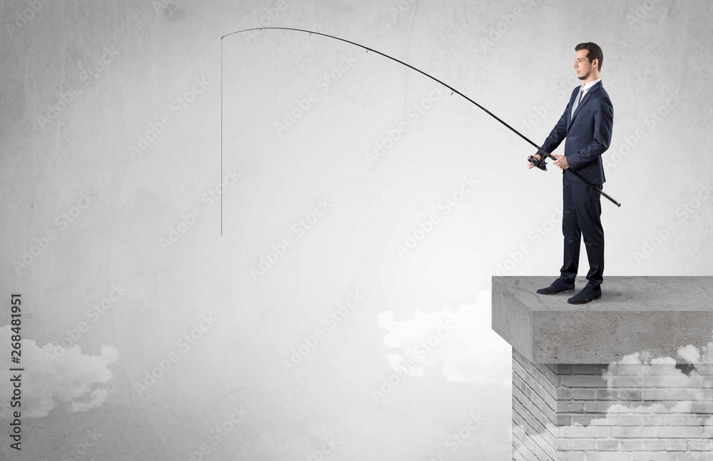 Businessman fishing nothing from the cloud with free copyspace Businessman fishing nothing from the cloud with free copyspace