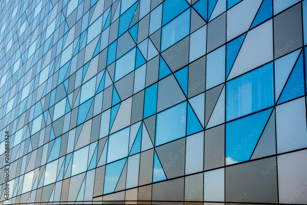 Grey faceted facade of a building. Grey faceted facade of a building.