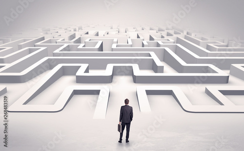 Businessman getting ready to enter a 3D flat labyrinth concept
 photo