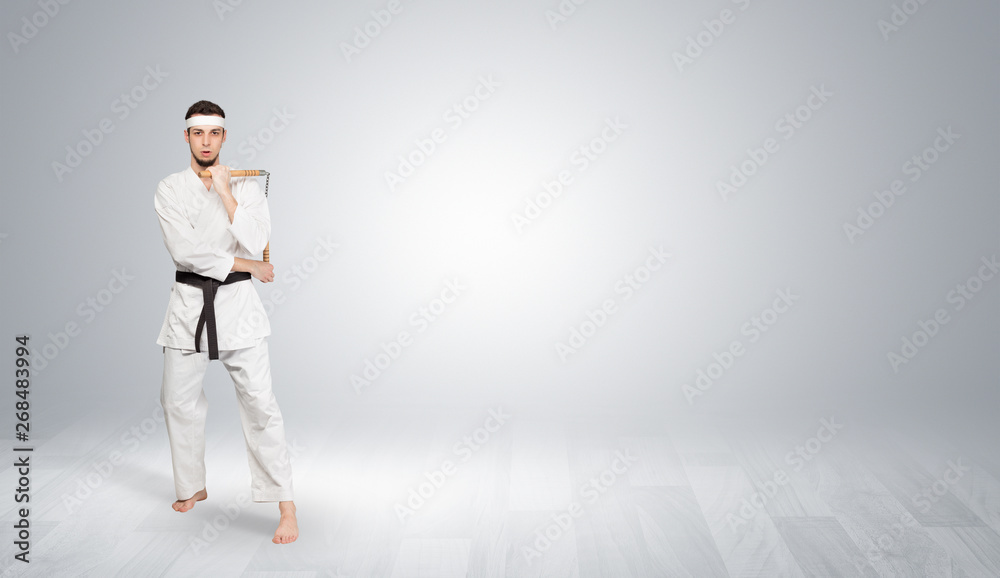 Young kung-fu trainer fighting in an empty space
Young kung-fu trainer fighting in an empty space