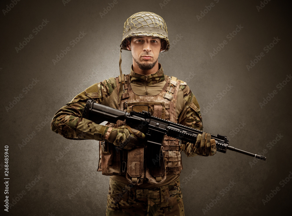 Soldier agent in a dark room with arms on his hand and gas mask
Soldier agent in a dark room with arms on his hand and gas mask