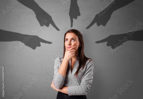 Fényképezés Young innocent  student with pointing hands concept