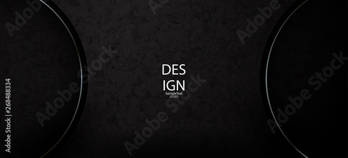 Textural abstract black background with two shiny rims