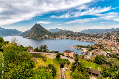 Scenic view of lake Lugano with Monte San Salvatore and Lugano town, Ticino, Switzerland