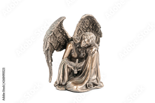 bronze statuette of an angel with bird