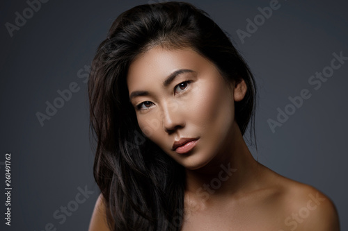 Obraz na plátně Beautiful asian woman with a black healthy hair