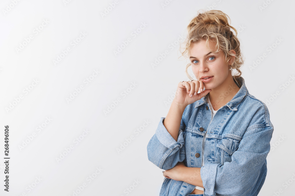 Inrigued good-looking scandinavian blond curly-haired woman blue eyes looking camera interested listening good advice suggestion standing thoughtful white background, consider make decision Inrigued good-looking scandinavian blond curly-haired woman blue eyes looking camera interested listening good advice suggestion standing thoughtful white background, consider make decision