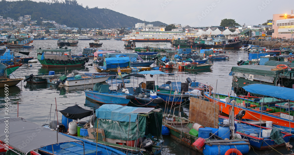  Crowded of small boat in Cheung chau island at sunset time