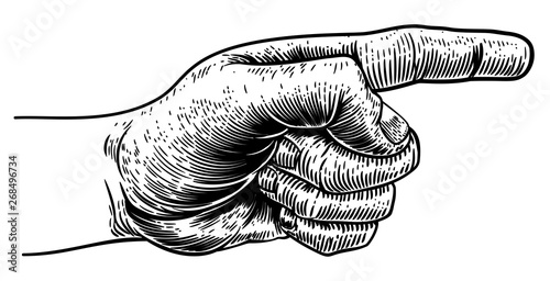 A hand pointing a finger in a direction sign. In a vintage antique engraving woodblock or woodcut style.