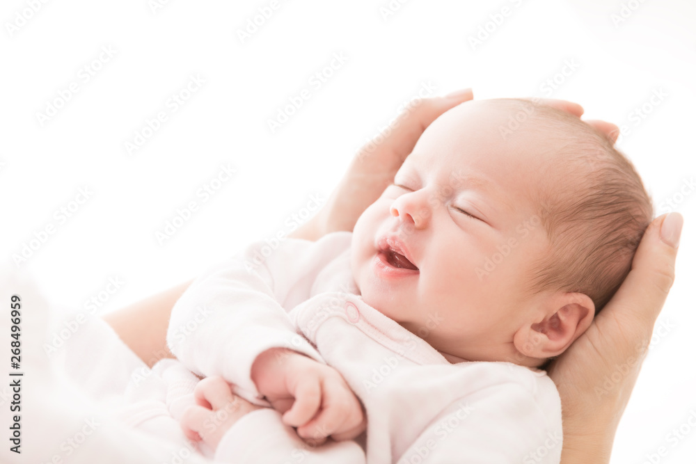 Newborn Baby Sleep on Mother Hands, New Born Girl Smiling and Sleeping, Happy Two Weeks Old Child on White Newborn Baby Sleep on Mother Hands, New Born Girl Smiling and Sleeping, Happy Two Weeks Old Child on White