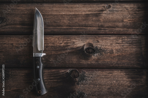 knife on wooden background