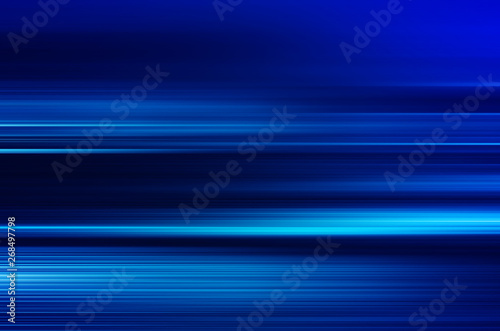 digitally generated image of blue light and stripes moving fast over black background