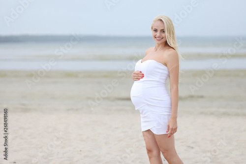beautiful pregnant woman on the beach