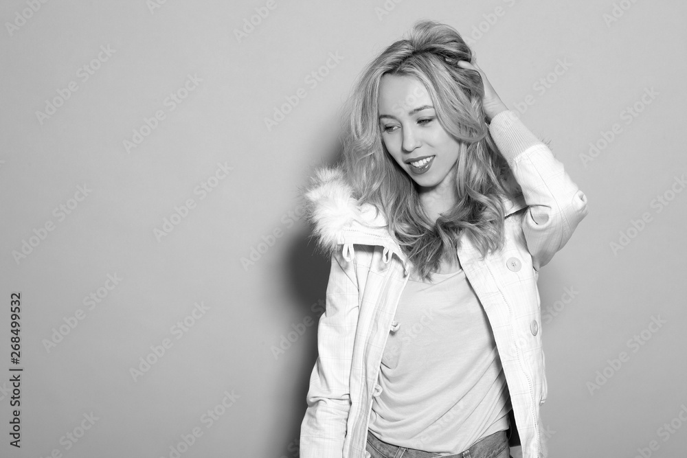 Fototapeta premium young beautiful girl in a white jacket