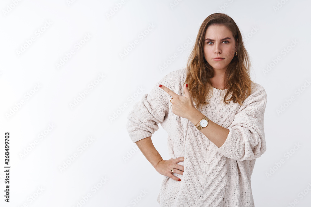Gorgeous sulking girlfriend demanding answers pointing displeased irritated upper left corner sideways disappointed frowning upset, waiting explanation questioned suspicious, white background Gorgeous sulking girlfriend demanding answers pointing displeased irritated upper left corner sideways disappointed frowning upset, waiting explanation questioned suspicious, white background