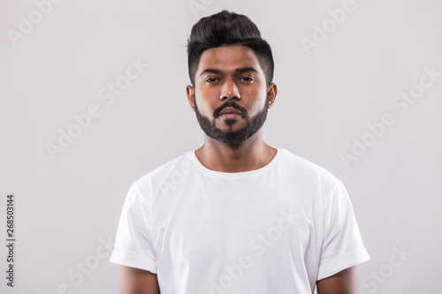 close up portrait of happy young indian man isolated on white background