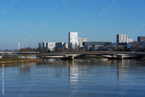The city center reflected in the river that runs through it © istvanszekany