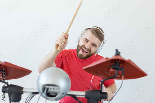 Emotions, hobbies, music and people concept - Emotional drummer plays the electronic drums