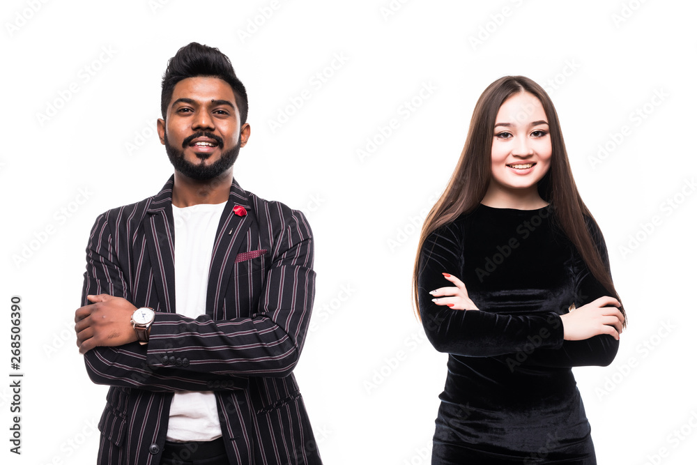 Asian couple in business suits standing together with arms crossed on white background Asian couple in business suits standing together with arms crossed on white background