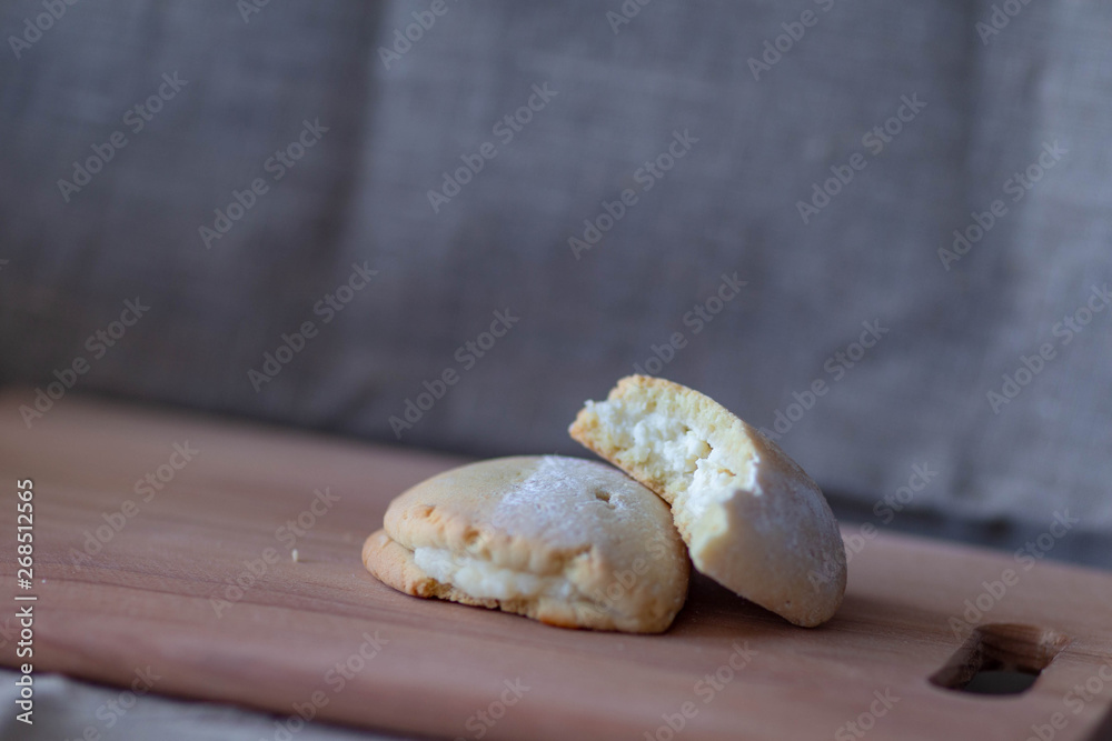 sochnik with cottage cheese on a wooden cutting Board on a background of canvas