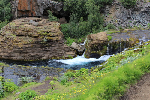 Deep Blue of a river in Gjain Gorge, Iceland photo