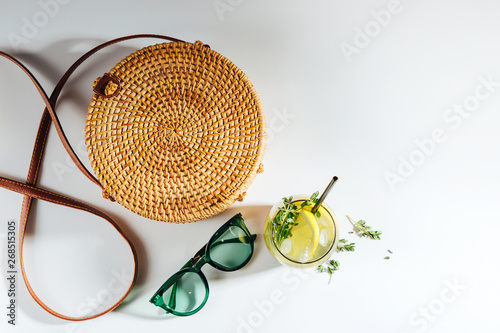 Bamboo bag with sunglasses and lemonade. Summer Vacation concept.