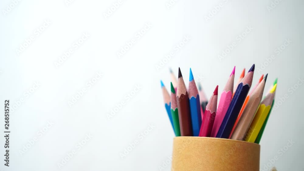 swivel of colored pencils in Spinning pencil brown box case on gray background. Black to school and writing for education. 4k swivel of colored pencils in Spinning pencil brown box case on gray background. Black to school and writing for education. 4k