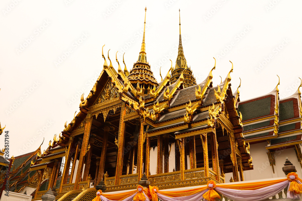 Wat Phra Kaew or Temple of Emerald Buddha, Guardian statues and Grand palace located within the grounds of the Grand Palace in Bangkok is Thailand’s most sacred temple and pilgrimage site for Thai